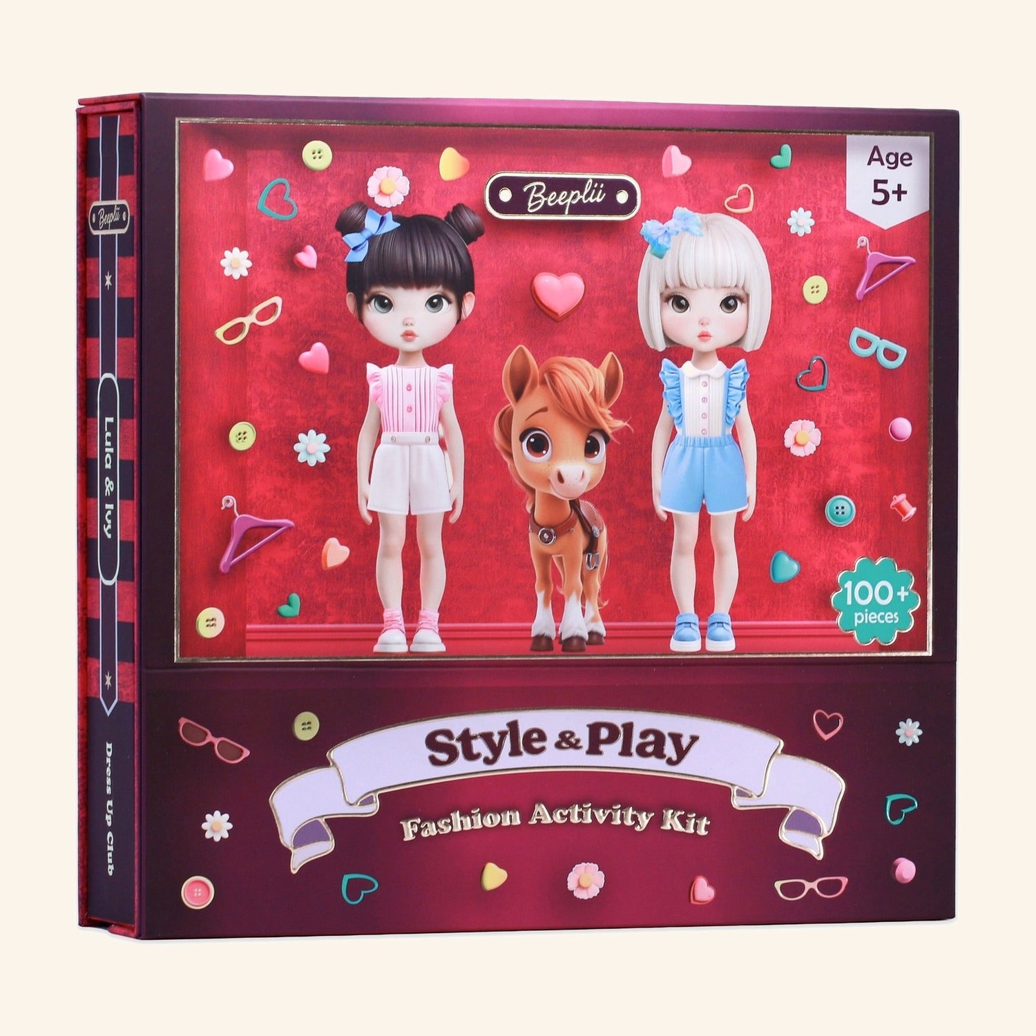 Style & Play Club kit. Burgundy keepsake box with Lula and Ivy framed in the gold window with their pony, on a cream-to-plum atmospheric backdrop